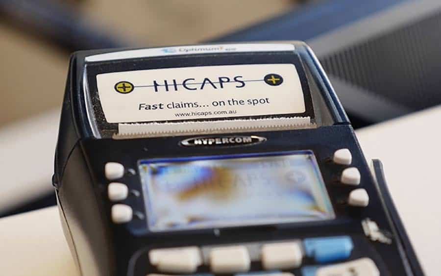 A HICAPS card terminal labelled Fast claims on the spot